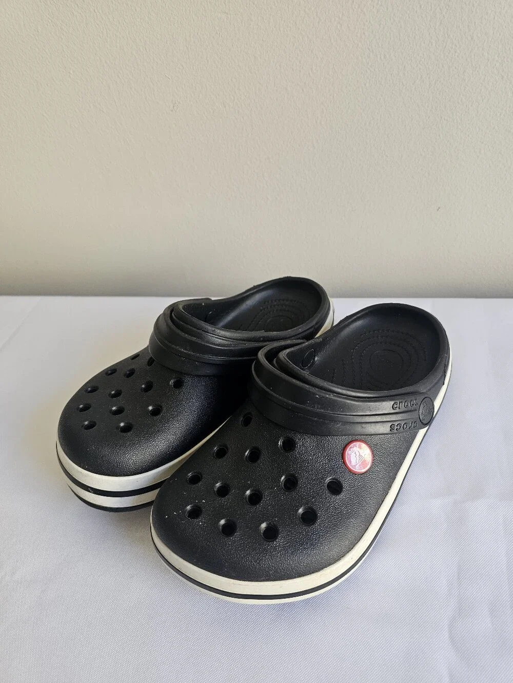 CROCS Kids Black Clogs with White Stripe